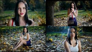 Smoking in the autumn park with lovely lady