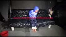 SANDRA tied, gagged and hooded with ropes and a ballgag on a sofa wearing sexy rainwear (Video)