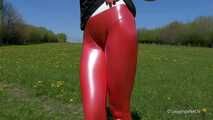 Red leggings on a green meadow