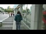 Alina walking on the street cruising around wearing sexy shiny nylon shorts under her jeans and a rain jacket (Video)