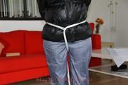 Nina tied and gagged in a shiny downjacket and rainpants