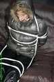 Watch Pia enjoying Bondage in her shiny nylon Downwear