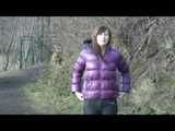 Alina wearing a jeans over a sexy shiny nylon shorts and a purple down jacket strolling on a lake (Video)