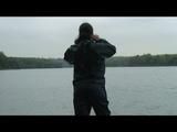 Enni wearing shiny nylon shorts and a rain jacket as well as a rain pants over the shorts (Video)
