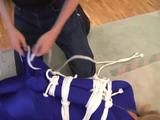 Gina in blue Lycra catsuit