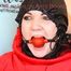 Jill tied, gagged and hooded with totally closed hood on a chair  wearing shiny downwear (Pics)