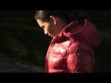 Enni taking a walk while wearing a sexy red down jacket and a shorts beneath the jeans (Video)