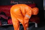 Watching Pia putting on a wonderful supersexy shiny nylon rainssuit in orange (Pics)