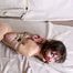 Topless cleavegagged barefoot Jessica, bound with her hands tied up in reverse prayer, poses on the floor