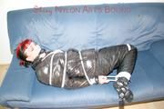 Jill tied and gagged wearing a sexy black down jacket and a sexy black rain pants (Pics)