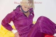 Pia in a shiny purple rainsuit tied and gagged in bed (Pics)