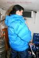 Jill tied and gagged in a refrigeration room wearing a blue shiny nylon down jacket and a black rain pants (Pics)