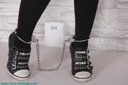 Loren handcuffed