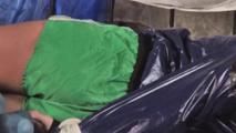 Alina tied and gagged in a princess bed standing in an old cellar wearing hot shiny nylon shorts and rainjacket (Video)
