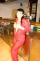 Jill posing sexy in an bar wearing sexy red shiny nylon rainwear (Pics)