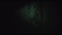 Jill tied, gagged and hooded on a cellar floor wearing a shiny green rain pants and a shiny black down jacket (Video)