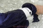 Nina tied and gagged in a shiny nylon down jacket and rainpants