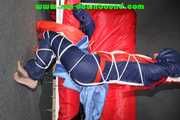 Sonja tied and gagged overhead with ropes and a ballgag wearing a sexy shiny nylon oldschool downbib (Pics)
