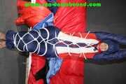 Sexy Sonja wearing a sexy oldschool shiny nylon downbib and donjacket being tied and gagged with ropes overhead (Pics)
