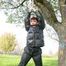 Jill tied and gagged outdoor on a tree wearing a sexy black downjacket and a black rain pants (Pics)