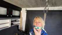 Myxxxy bound and gagged, wearing shiny nylon shorts and a windbreaker