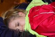 Samantha tied and gagged in a shiny light blue nylon shorts and a red shiny rainjacket (Pics) 
