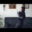 Jill lolling on a sofa wearing sexy shiny nylon rainwear (Video)