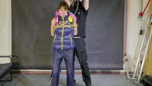 Lana bound and gagged in a shiny nylon Downvest