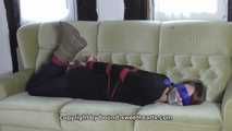 Vanessa hogtie on couch 2/2