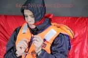 *** HOT HOT HOT*** NEW MODELL*** DESTINY wearing a sexy blue/red shiny nylon rain suit and a life jacket ties and gagges herself with cuffs on a sofa (Pics)