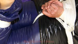 Alina tied and gagged in shiny down clothes