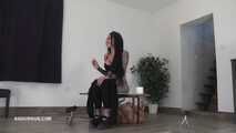 Mistress Cleo squirts cologne into the mouth of the slave lying in the toilet.