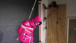 Rachel Adams bound, Pantygagged and Pantyhooded in a shiny nylon Downjacket