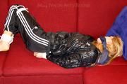 Samantha bound and gagged in shiny nylon rainwear