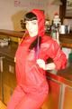 Jill posing sexy in an bar wearing sexy red shiny nylon rainwear (Pics)
