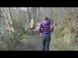 Alina wearing a jeans over a sexy shiny nylon shorts and a purple down jacket strolling on a lake (Video)