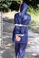 Stella bound outdoor in a blue rainsuit