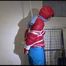 Mara tied, gagged and hooded in a laundry wearing a sexy blue down pants and a red down jacket (Video)