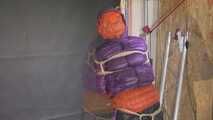 Rachel Adams bound, gagged and double hooded in shiny downjackets