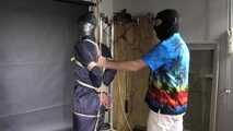 Myxxxy bound and gagged in a shiny nylon Rainsuit