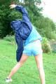 Enni wearing sexy blue shiny nylon shorts and rainjacket during her warm-up (Pics)