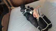 Rachel Adams tied and gagged in Rainwear