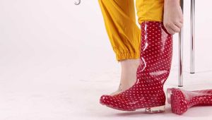 Watching sexy Jill wearing a sexy yellow shiny nylon rainwearcombination and a red shiny nylon raincoat posing for you (Pics)