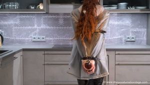 Miss Lara in Hunter rain jacket and vinyl catsuit bondage