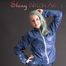 Mara posing in the studio wearing a blue rain skirt and a blue rain jacket as wellas red rubber boots (Pics)