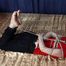 Ballgagged barefoot Tammy in red t-shirt and black jeans, hogtied with hemp rope