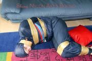 Jill tied, gagged and hooded on the floor with tape wearing an oldschool rain combination (Pics)