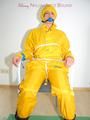 Katharina tied, gagged and hooded on a chair wearing sexy yellow rainwear (Pics)