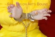 Jill ties, gagges and hoodes herself wearing a shiny yellow down jacket and a yellow rain pants(Pics)