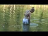 Jenny swimming in the sea wearing sexy shiny nylon shorts and a bikini top (Video)